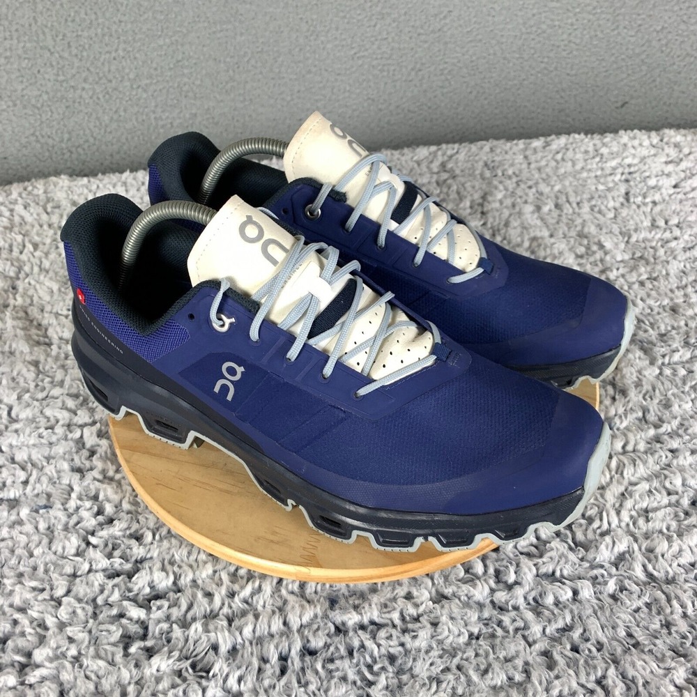 On Running Blue and Cream Athletic Shoes